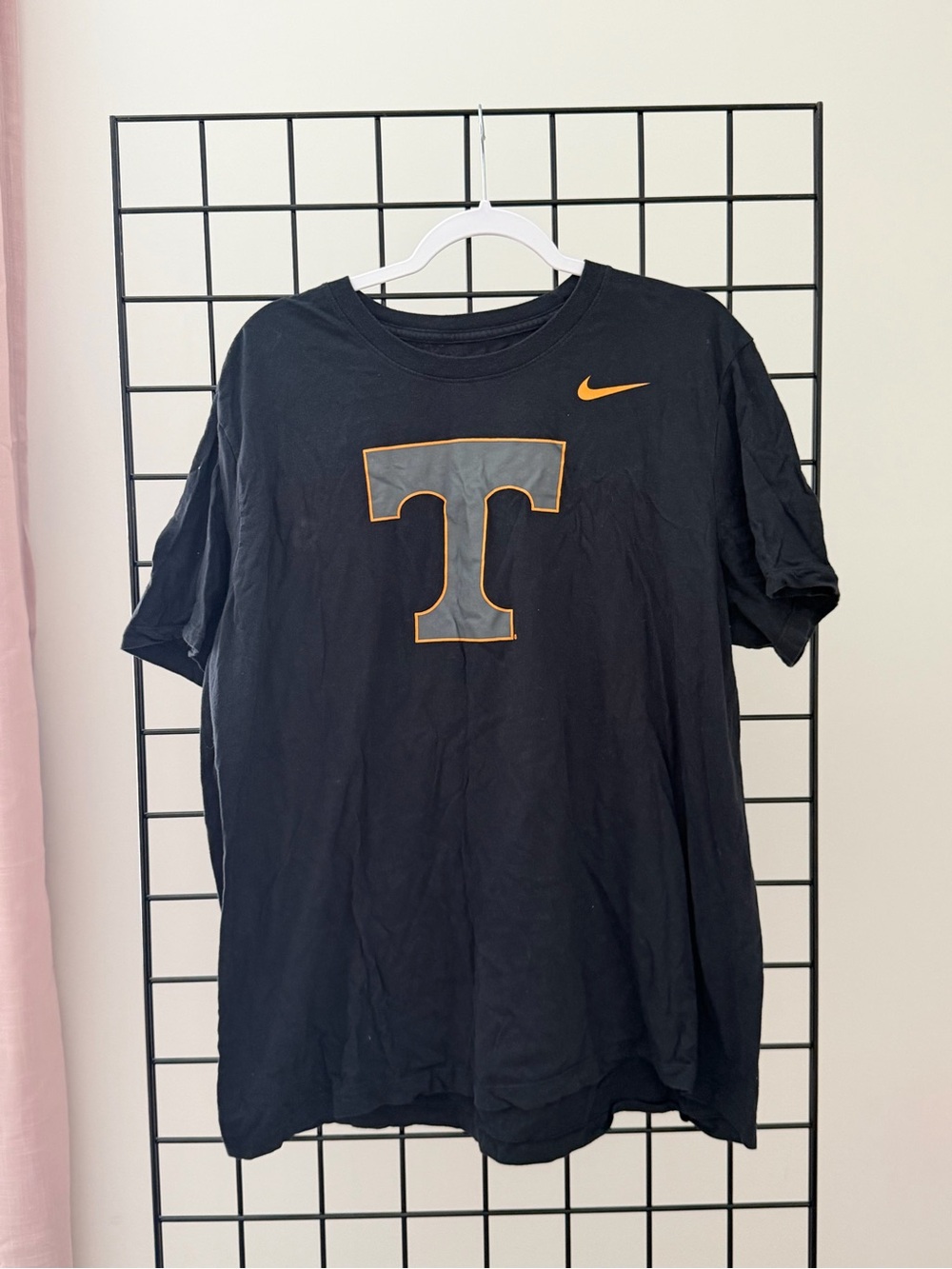 Nike Black Tee with Orange-Outlined Grey 'T' Logo